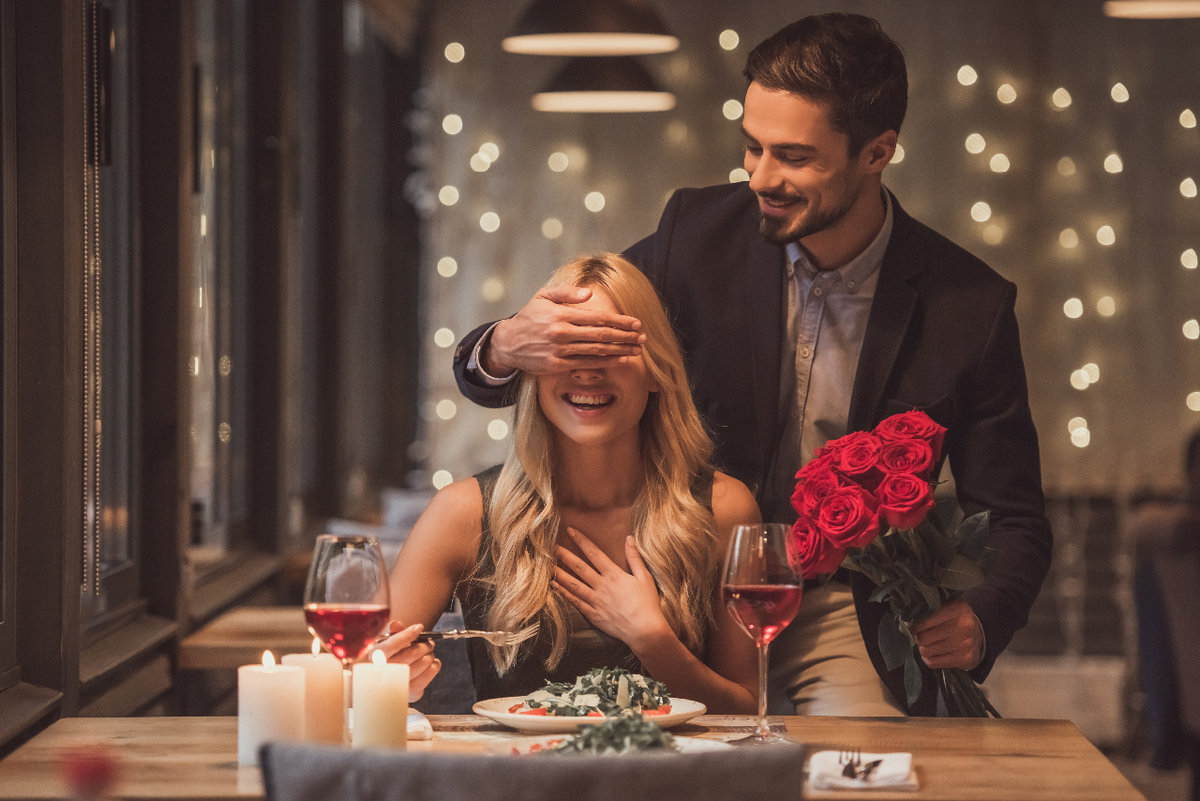 A couple celebrating Valentine's Day at a restaurant