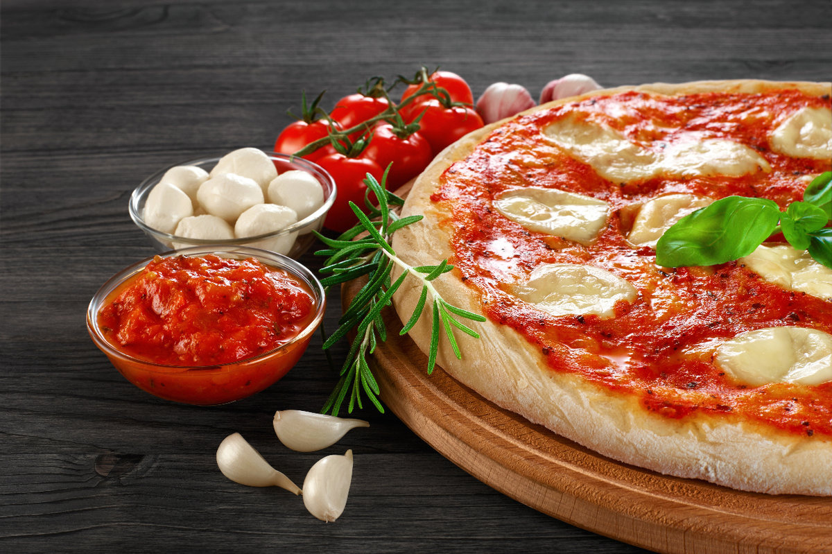 Margherita pizza on a dark background