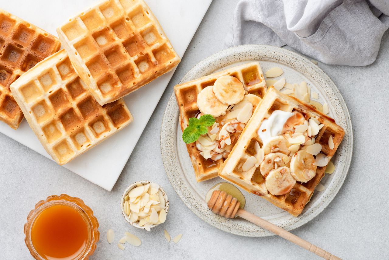 Waffles with bananas almonds and yogurt