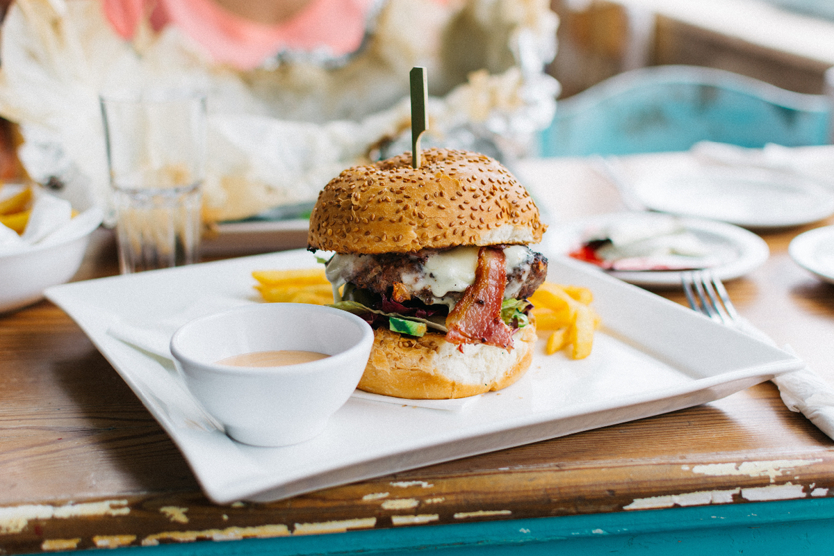 Delicious burger with bacon and fries