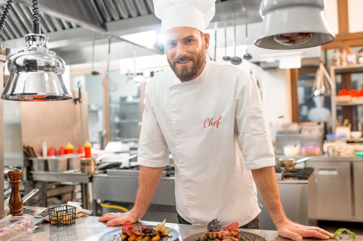 Smiling chef in a restaurant kitchen
