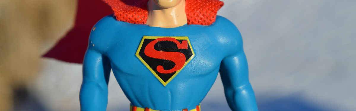 Picture of a toy Superman focusing on his symbol