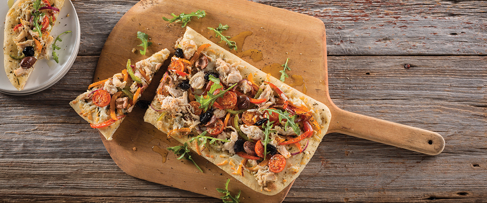 Maple Leaf Pulled Chicken Pizza on flatbread with olives and tomatoes